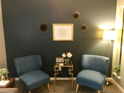 Photo of Suite 202 waiting room chairs and table